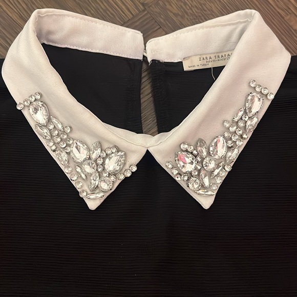 Black dress with white collar that has crystals. - Picture 2 of 6